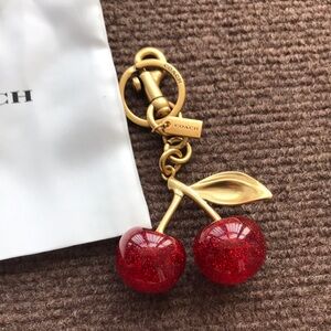 Coach Red Glitter Cherry Keychain with Gold Hardware